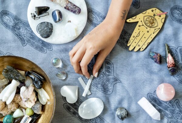 Hand picking out a Selenite crystal